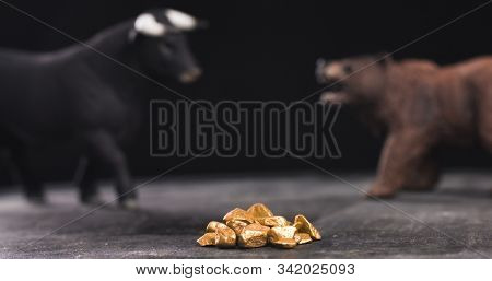 Gold Market Bearish Or Bullish Trend With Bull And Bear Figures In Background