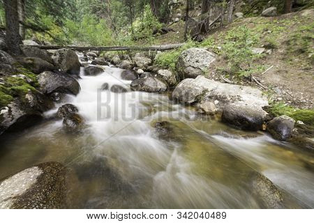 Colorado Flowing Creek High In The Rocky Mountains.