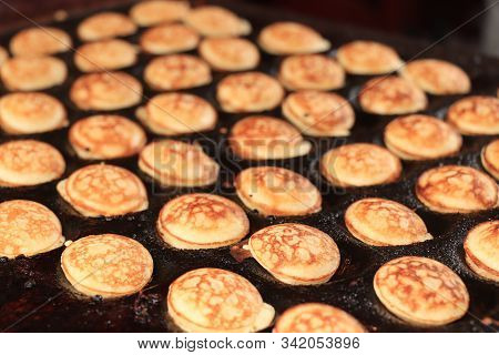 Poffertjes, Dutch Small, Fluffy Pancakes, Made On Hot Cast Iron Plate, Served With Powdered Sugar An