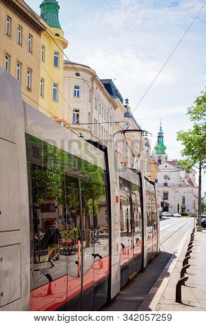 Typical Red Tram On Road In Wiedner Hauptstrasse Of Vienna