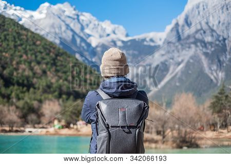 Young Man Traveler Traveling At Blue Moon Valley, Landmark And Popular Spot Inside The Jade Dragon S