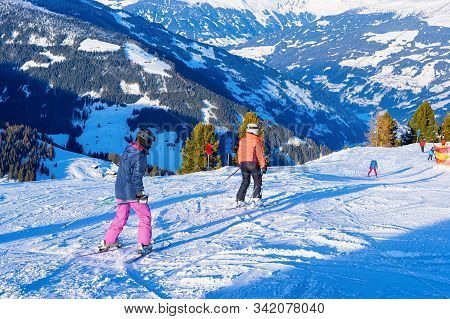 People Skier Skiing On Ski Resort Penken Park In Austria