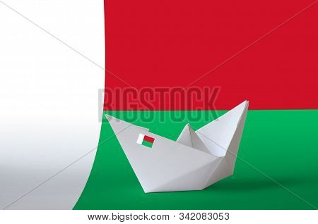 Madagascar Flag Depicted On Paper Origami Ship Closeup. Handmade Arts Concept