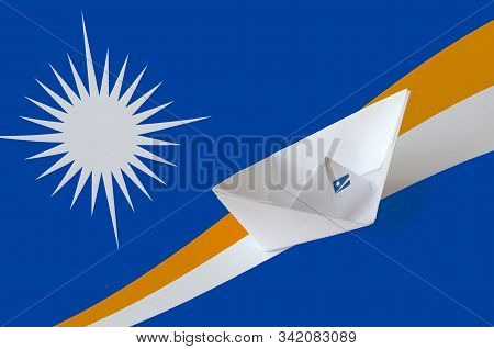 Marshall Islands Flag Depicted On Paper Origami Ship Closeup. Handmade Arts Concept