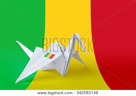 Mali Flag Depicted On Paper Origami Crane Wing. Handmade Arts Concept