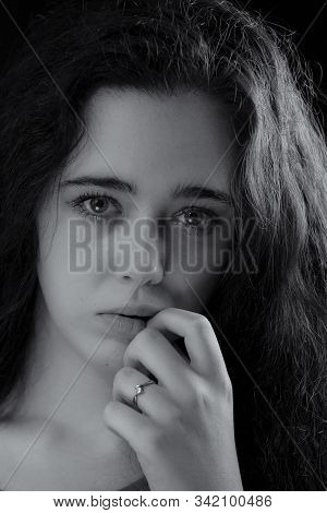 Portrait Of Pretty Young Woman With Ring.