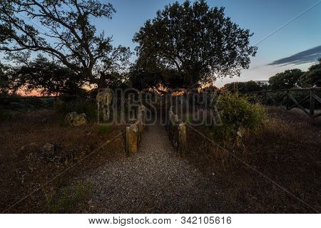 Landscape At Dusk With Ancient Prehistoric Dolmen. Gran Dolmen In Montehermoso. Extremadura Spain.