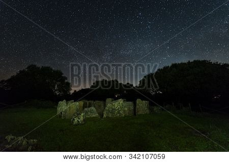 Dolmen Of The Great Oak. Night Landscape With Ancient Prehistoric Dolmen. Montehermoso. Extremadura.
