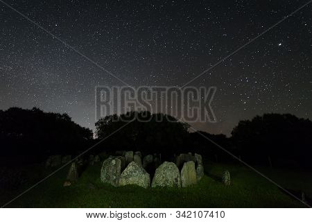Dolmen Of The Great Oak. Night Landscape With Ancient Prehistoric Dolmen. Montehermoso. Extremadura.