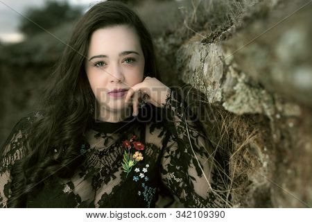 Portrait Of Young Woman With Black Clothes.