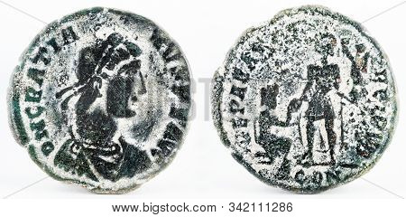 Ancient Roman Copper Coin Of Gratian. Macro Photography.
