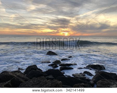 Bright Sunset On The Beach Of Costa Da Caparica, Portugal