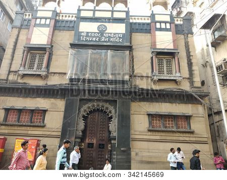 Mumbai, India - December, 2019: Jain Digambar Temple In Mumbai With Old Buildings And People Walking