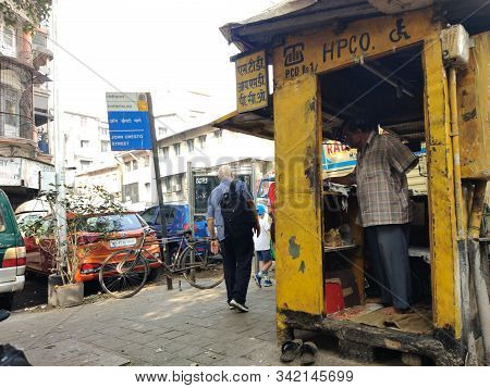 Mumbai, Maharashtra, India - December 2019: A Candid Street Portrait Of A Handicapped Vendor At A Te