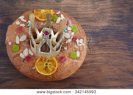 Epiphany Cake, Kings Cake, Roscon De Reyes Or Rosca De Reyes On Wooden Table