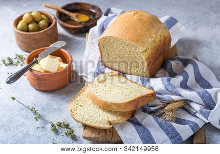 Fresh Homemade Crisp Bread  And Slices With Olive Oil, Butter And Green Olives, Top View.  Baking Co