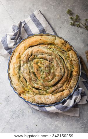 Spanakopita. Greek Pie Spanakopita  Over Concrete  Background. Ideas And Recipes For Vegetarian Or V