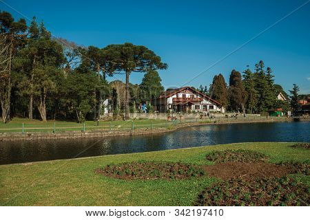 Gramado, Brazil - July 21, 2019. Wooded Park With The Joaquina Rita Bier Lake And House In German-in