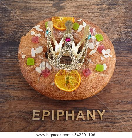 Epiphany Cake, Kings Cake, Roscon De Reyes Or Rosca De Reyes On Wooden Table