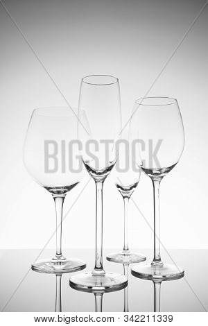 Glassware Selection With Wine, Champagne And Liquour Glasses. Fine Cristal Glassware Concept. Vertic