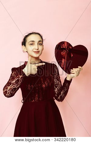 Portrait Of Attractive Hispanic Woman Holding Giftbox. Valentines Day Gifts. Beautiful Middle-easter