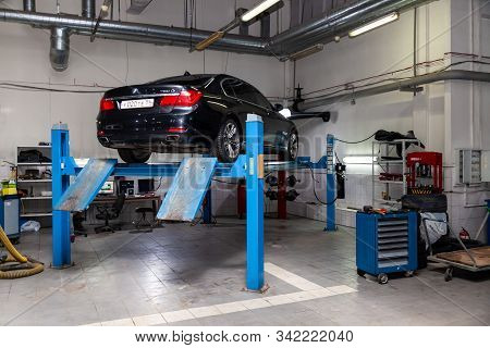 Novosibirsk, Russia - 08.01.2018: Used Car Bmw Stands On The Stand Wheel Alignment Convergence Of Th