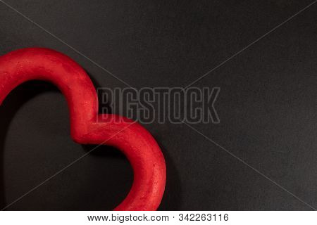 Grunge Red Paper Heart On A Black Background