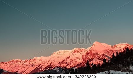 Sunset In The Mountains Between Slovenia And Italy In A Freezing Winter Day