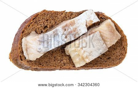 Top View Of Open Sandwich With Rye Bread And Pickled Herring Isolated On White Background