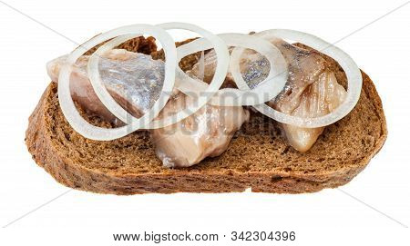 Open Sandwich With Rye Bread And Pickled Herring Decorated Of Onion Rings Isolated On White Backgrou