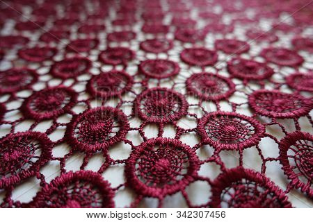 Macro Of Dark Red Lacy Fabric With Circular Pattern