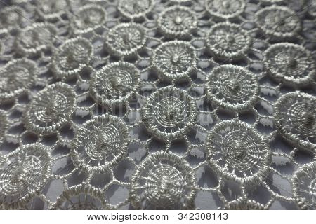Close Shot Of Ivory White Lacy Fabric