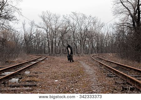 A Man On The Railway Steps On A Journey From Hustle And Bustle. Stock Photo.