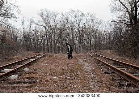 A Man On The Railway Steps On A Journey From Hustle And Bustle. Stock Photo.