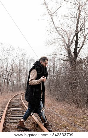 A Man On The Railway Steps On A Journey From Hustle And Bustle. Stock Photo.