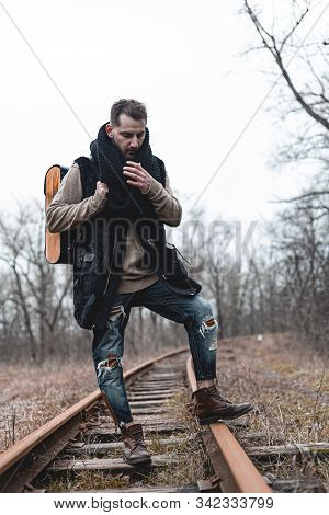A Man On The Railway Steps On A Journey From Hustle And Bustle. Stock Photo.