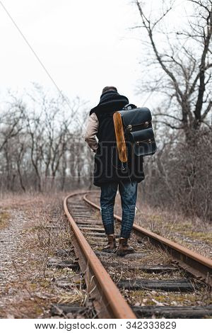 A Man On The Railway Steps On A Journey From Hustle And Bustle. Stock Photo.