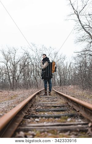 A Man On The Railway Steps On A Journey From Hustle And Bustle. Stock Photo.