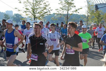 Warsaw, Poland - April 14, 2015: Orlen Warsaw Marathon. Group Of Athletes Running On A Street.