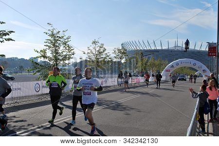 Warsaw, Poland - April 14, 2015: Orlen Warsaw Marathon. Group Of Athletes Running On A Street.