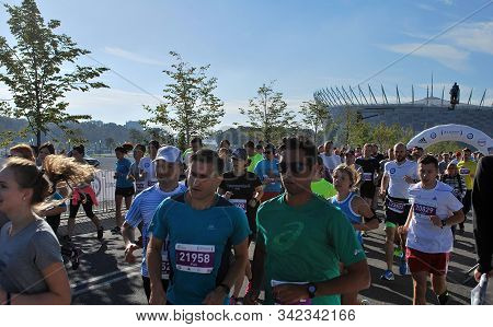 Warsaw, Poland - April 14, 2015: Orlen Warsaw Marathon. Group Of Athletes Running On A Street.