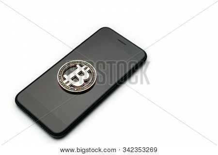 Bit Coin. Gold Cryptocurrency, Black Smartphone Isolated On White Background. Litecoin, Ethereum Cry