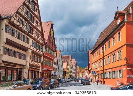 Dinkelsbuhl, Germany - May 11, 2019: Colorful houses at along touristic Segringer Street