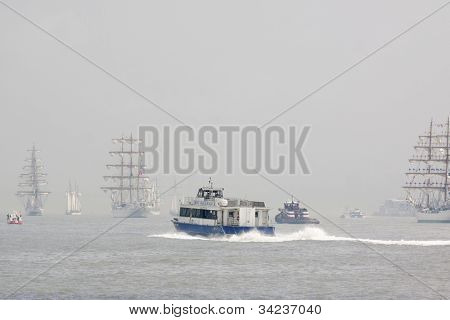 HOBOKEN, NJ - MAY 23: A NY Waterway ferry boat moves up the Hudson River near Manhattan during the Parade of Sails on May 23, 2012 in Hoboken, NJ. The parade marks the start of Fleet Week.