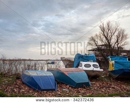 Boats And Ships, Some Fishing Ships And Old And Rusty Abandoned Boats Standing On The Riverbanks Of 