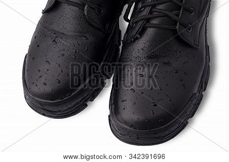 Drops Of Water On Black Leather Shoes. Isalized On A White Background. Concept: Processing And Care 