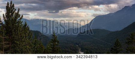 Beautiful View Of The Valley Surrounded By The Canadian Mountain Landscape During A Cloudy Sunset. T