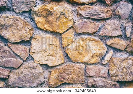 Rough Textured Background Of Old Brown Brick Wal, Old Brick Wall Background Of Ancient Stones, Aged 