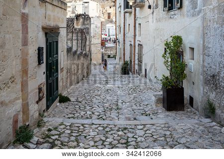 Matera, Italy - September 14, 2019: Cobblestone Street In The Sassi Di Matera A Historic District In
