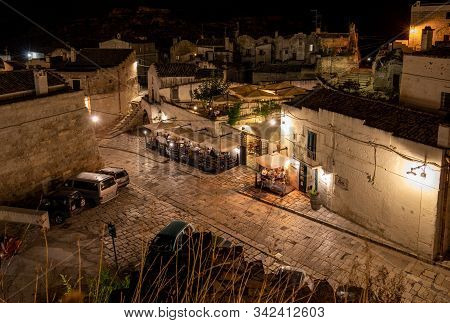 Matera, Italy - September 19, 2019: Evening View Of The City Of Matera, Italy, With The Colorful Lig